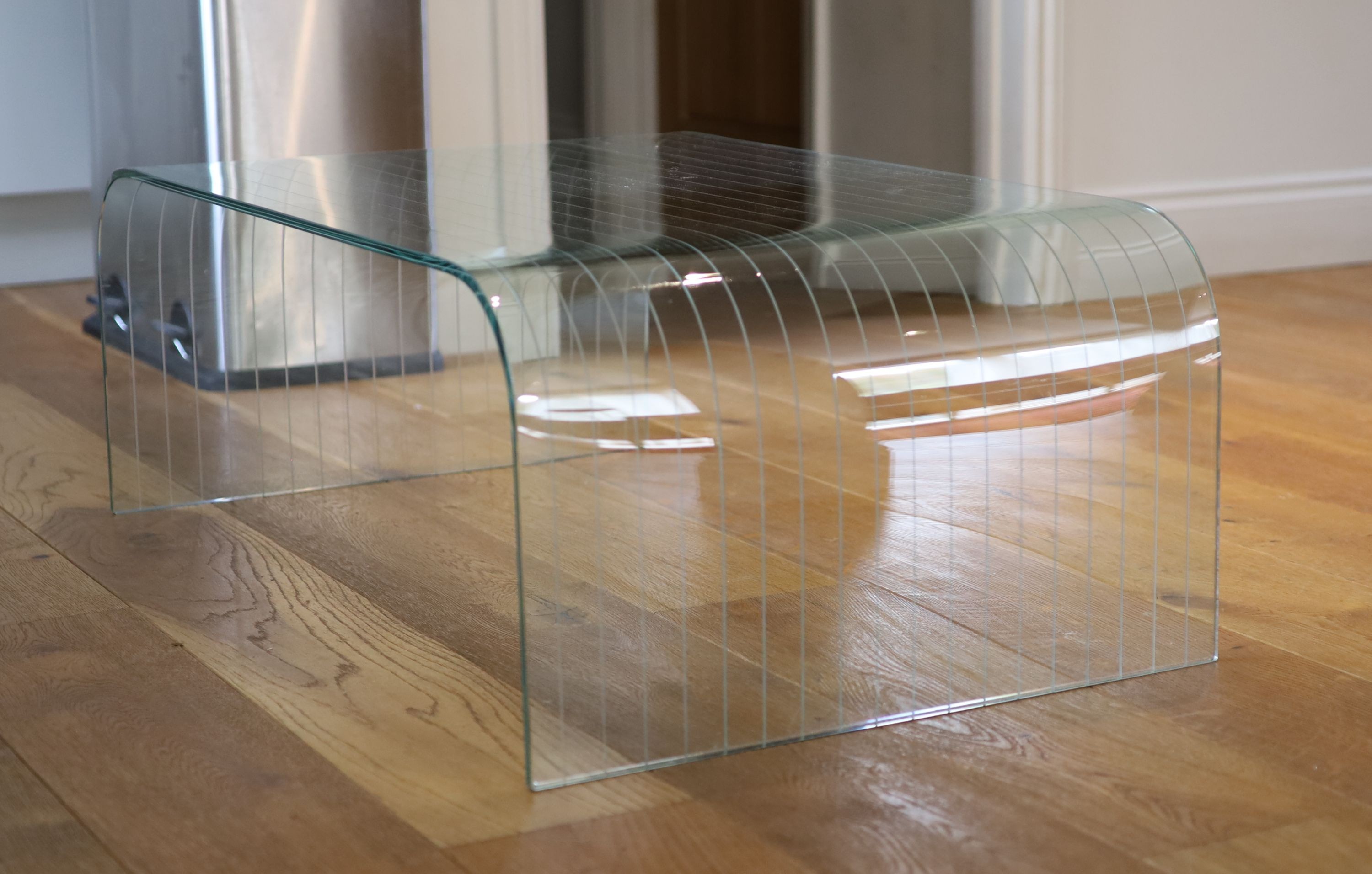 A ribbed glass waterfall coffee table, width 101cm depth 60cm height 36cm